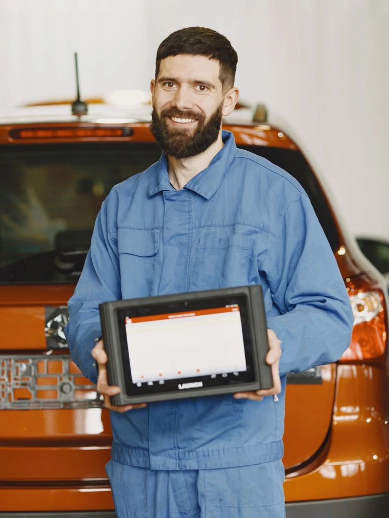 Autel MaxiSYS MS919 diagnostic tablet on magnetic dock with J2534 pass-thru VCI
